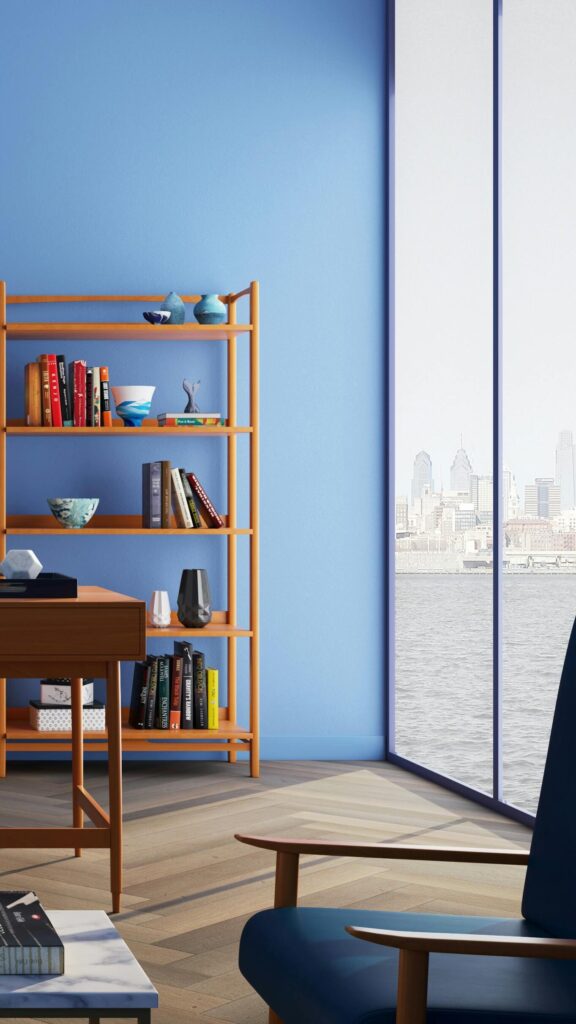 Elegantly decorated home office with modern furniture and a blue wall.